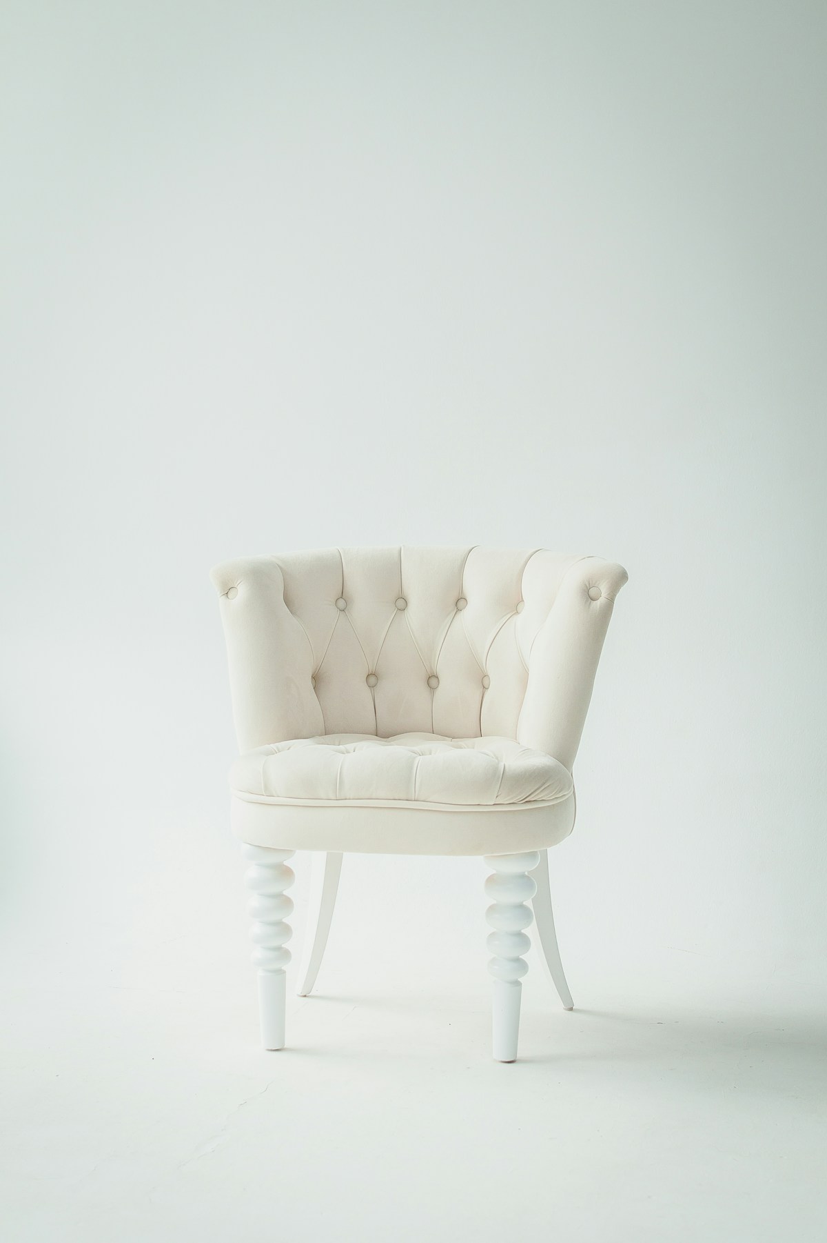A cream upholstered chair with another chapter ahead
